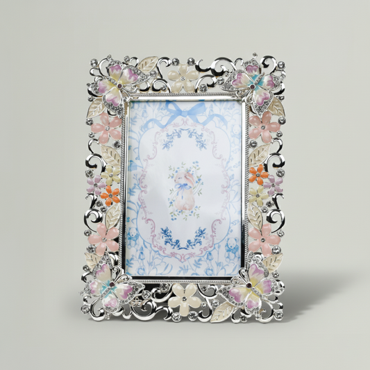 Decorative photo frame with floral design on a light gray background