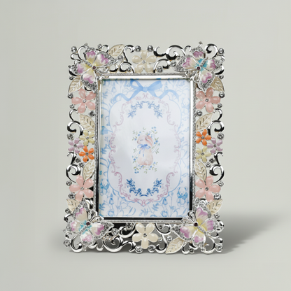 Decorative photo frame with floral design on a light gray background