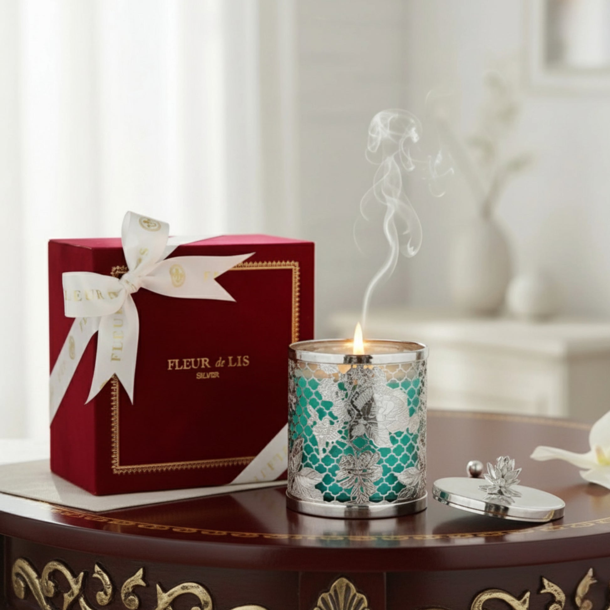 Candle with decorative box on a table