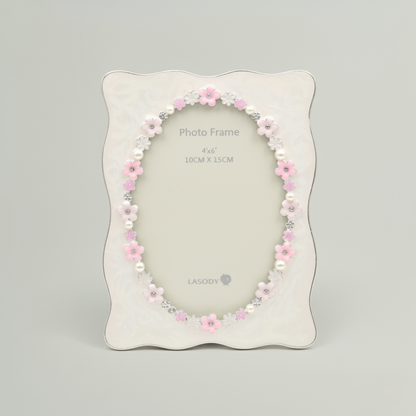 Decorative photo frame with floral design on a gray background
