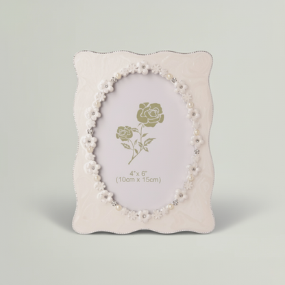 Decorative photo frame with floral design on a gray background