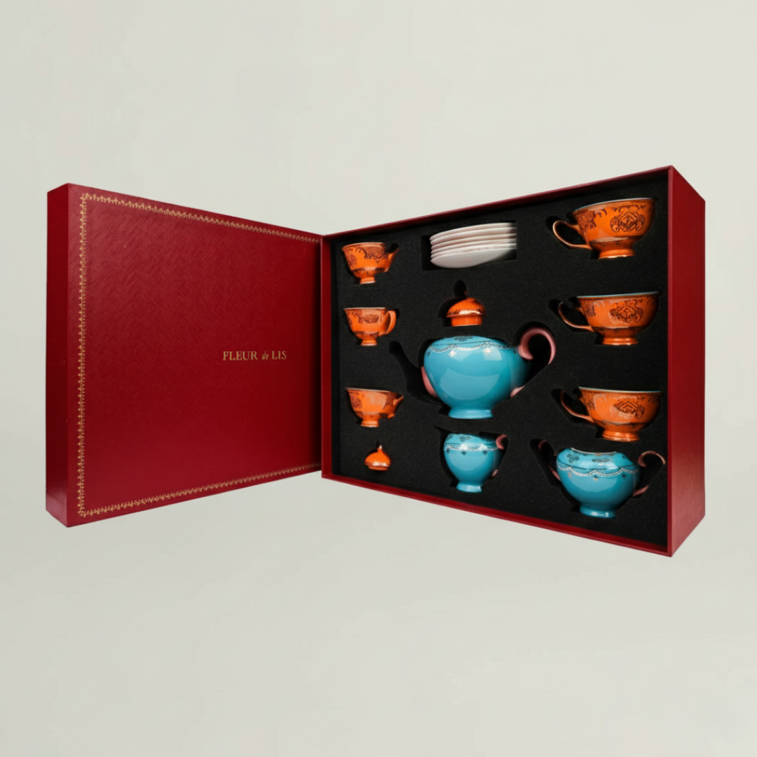 Royal blue ceramic tea set with matching cups and teapot, beautifully arranged in a Fleur de Lis premium gift box.