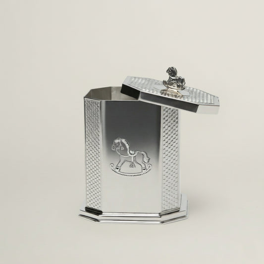 Handcrafted octagonal silver baby keepsake box featuring an engraved rocking horse motif and a miniature horse handle on the lid.