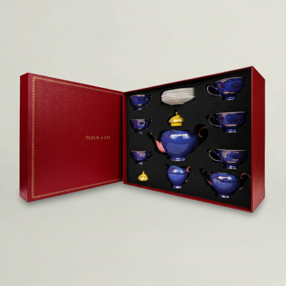 Elegant turquoise ceramic tea set with coordinated cups and teapot, showcased in a premium Fleur de Lis presentation box.